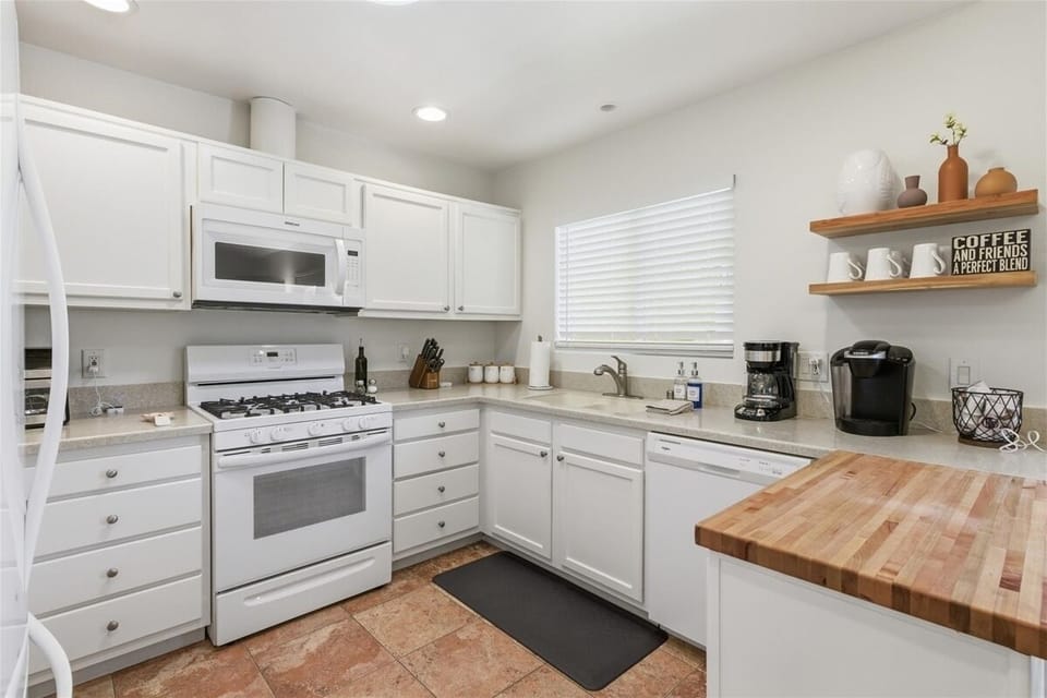 Clean modern kitchen with gas stove and ample counter space