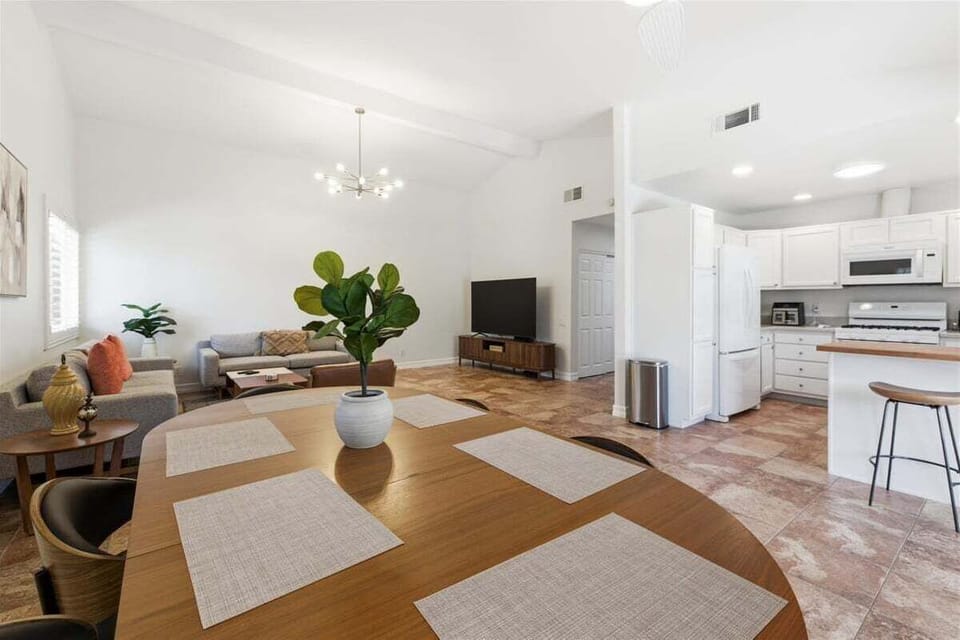 Open dining area flowing into living room and kitchen