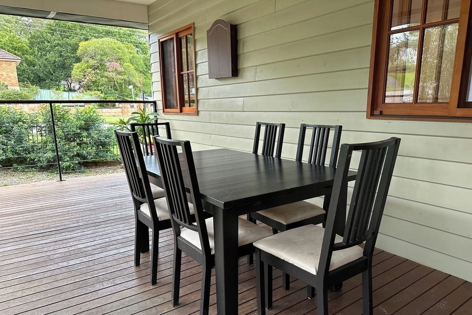 An inviting outdoor dining setup located on a wooden deck.