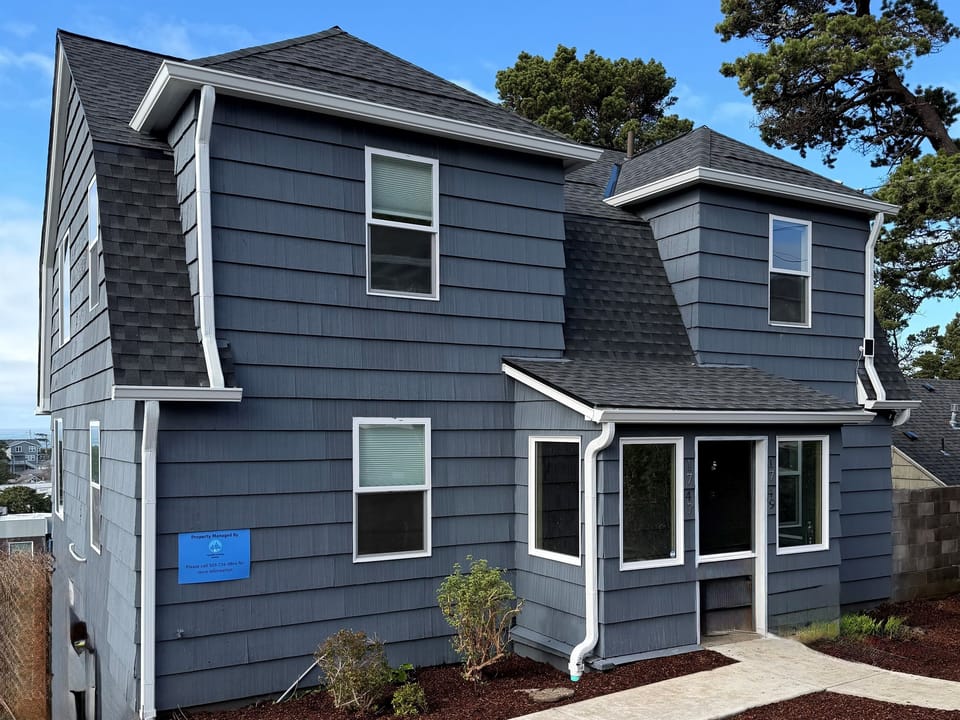 Exterior: Charming coastal retreat with a complete remodel finished in 2026.