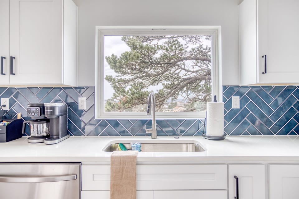 Kitchen: Enjoy ocean views while crafting culinary delights in this stylish space!