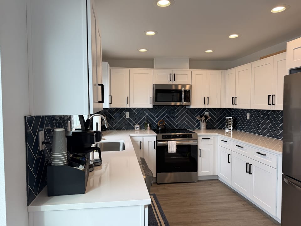 Kitchen Delight: Enjoy culinary adventures in this bright, modern kitchen with sleek finishes!