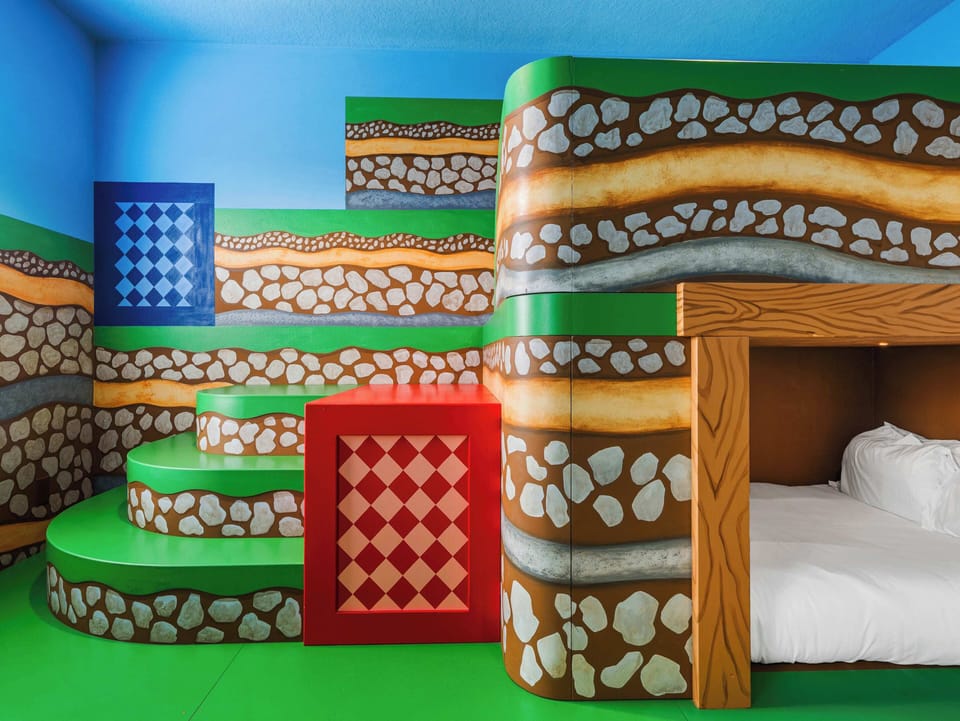 Close-up of themed bunks w/ steps, tunnel & bold, colorful details
