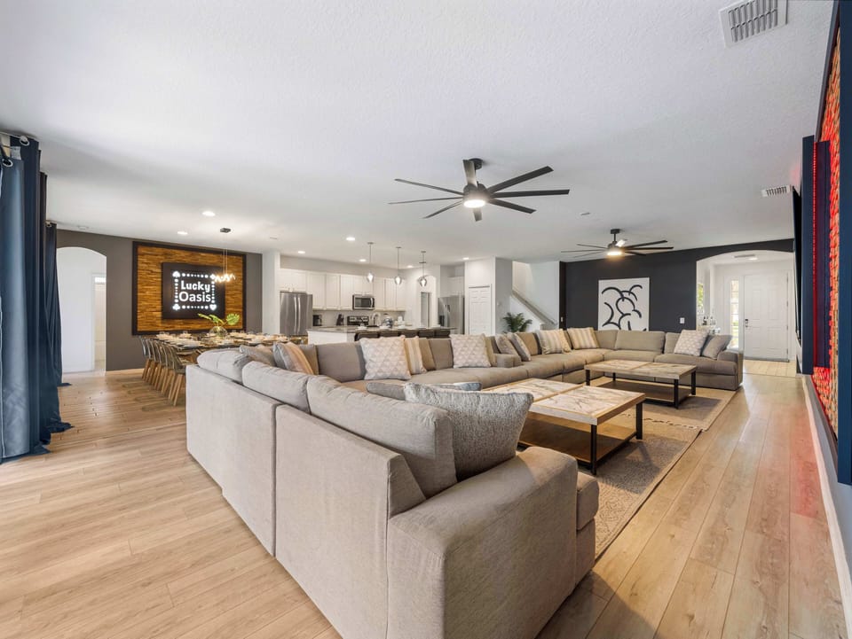 Open-concept living area blending kitchen, dining & lounge w/ ample seating