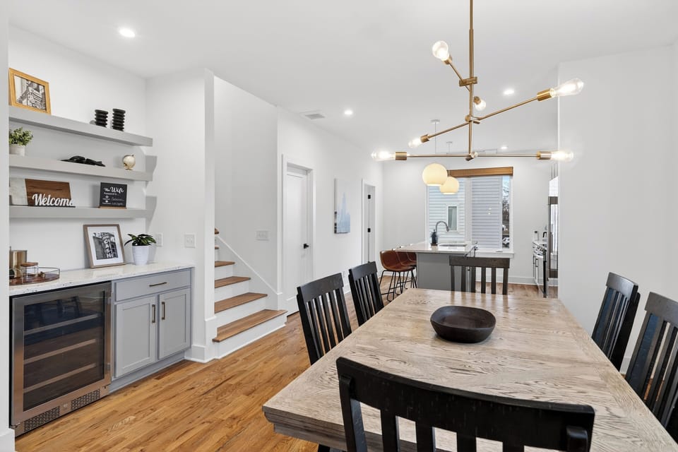 The spacious dining area is perfect for shared meals and celebrations, with stylish lighting and easy flow into the kitchen.