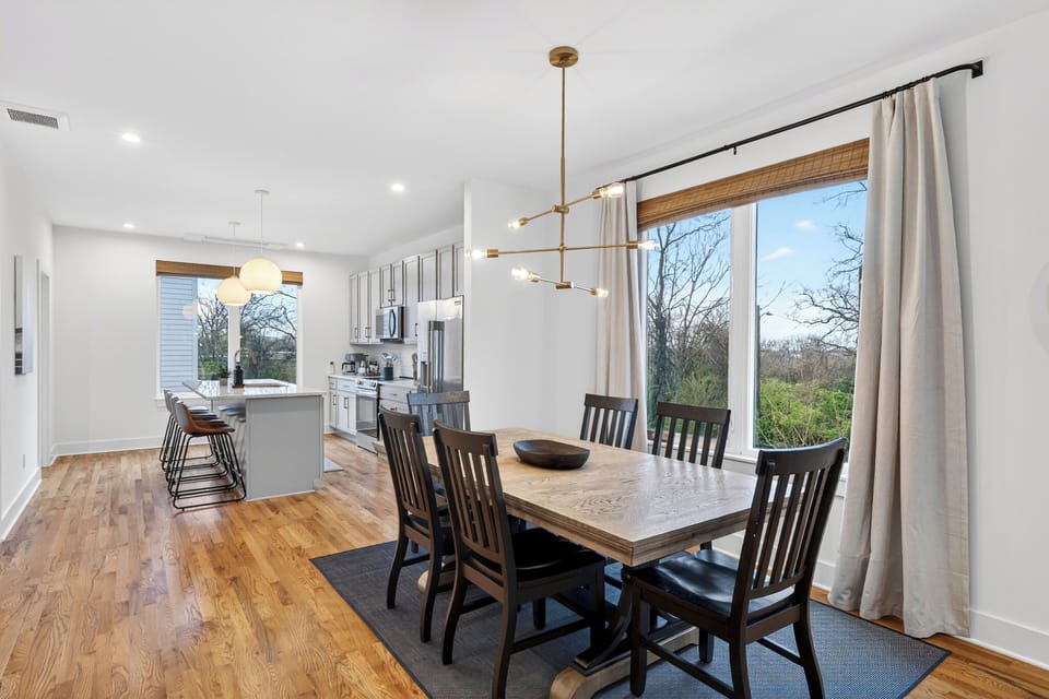 The spacious dining area is perfect for shared meals and celebrations, with stylish lighting and easy flow into the kitchen.