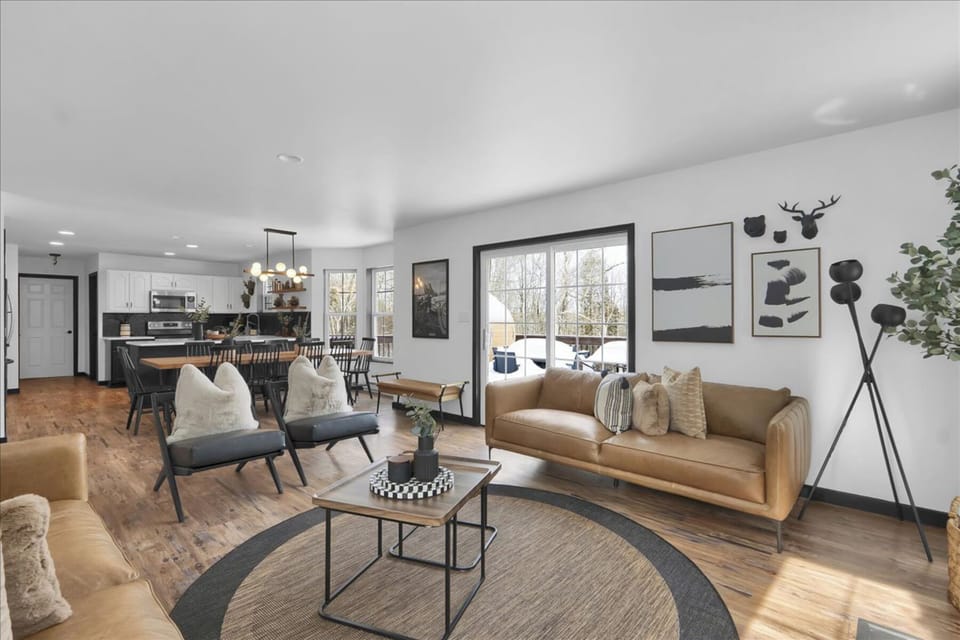 Spacious open-concept living with a cozy lounge, dining for the whole crew, and easy access to the deck for fresh mountain air.