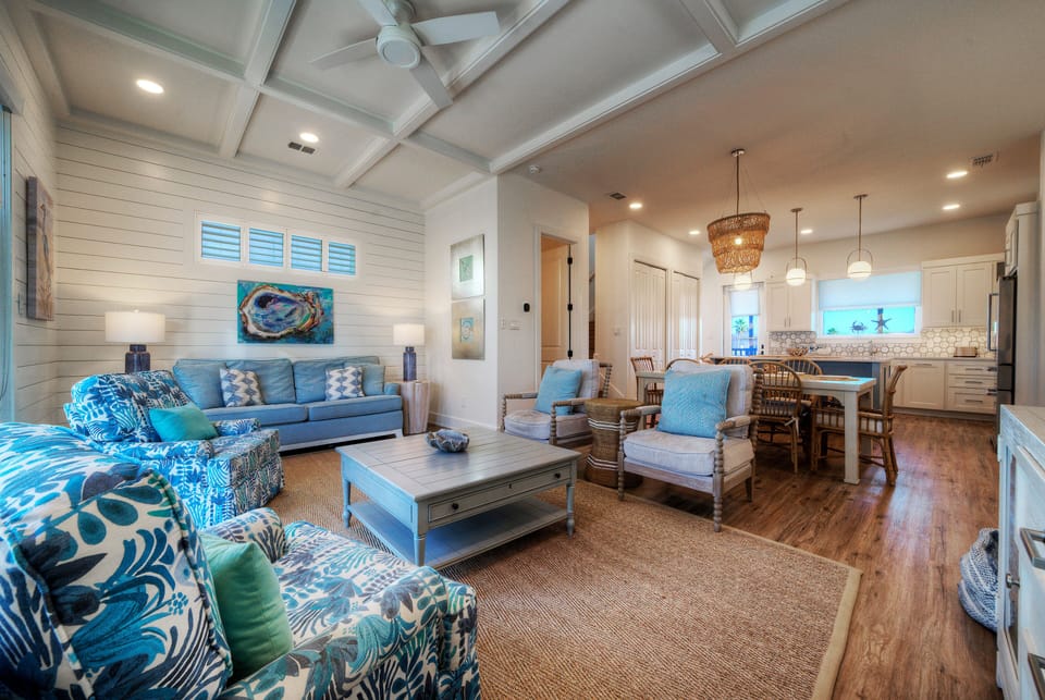 Open-concept living area with comfortable seating and a view toward the dining space. (Southern Cross)