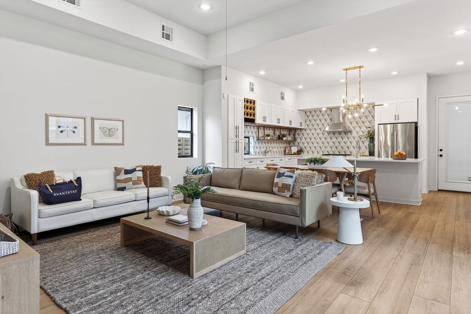 Bright, open-concept living with designer finishes—perfect for relaxing, gathering, and sharing meals in the sleek kitchen and dining space.