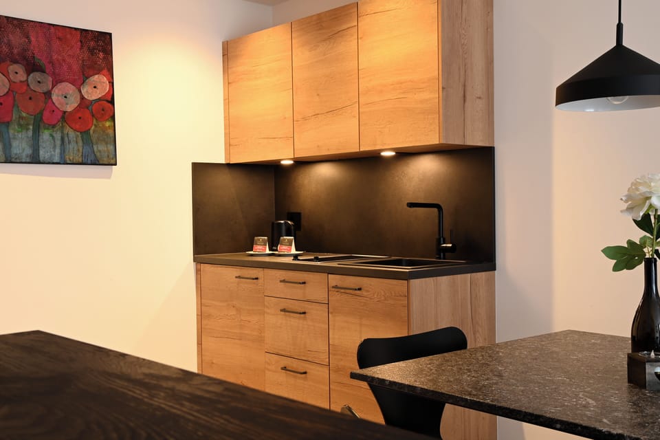 Deluxe Apartment, Balcony, Mountain View | In-room dining