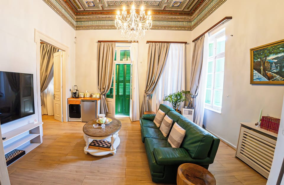 Deluxe Apartment, Balcony, Sea View | Living area | Flat-screen TV