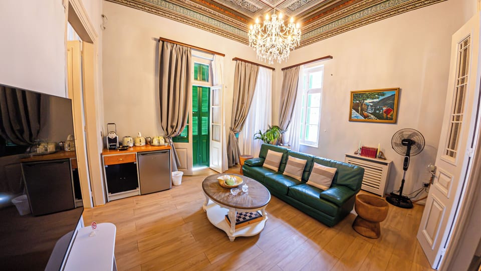 Deluxe Apartment, Balcony, Sea View | Living area | Flat-screen TV