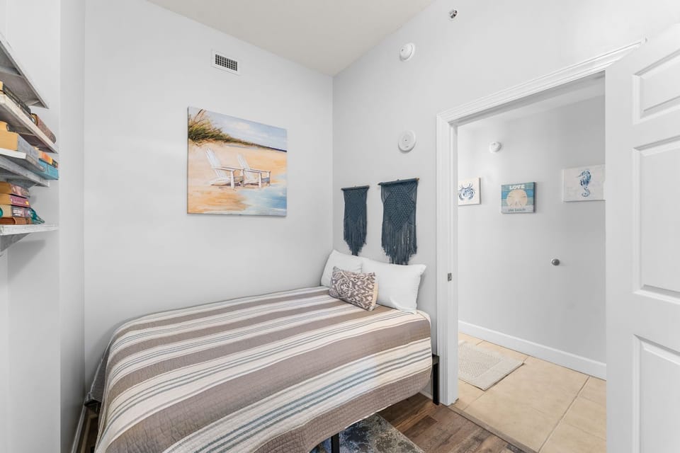 The third bedroom offers a full-sized bed and its own television.