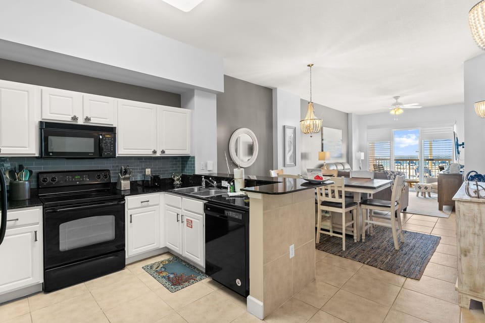 The fully equipped kitchen features granite countertops and has everything you need to prepare meals for family & friends.