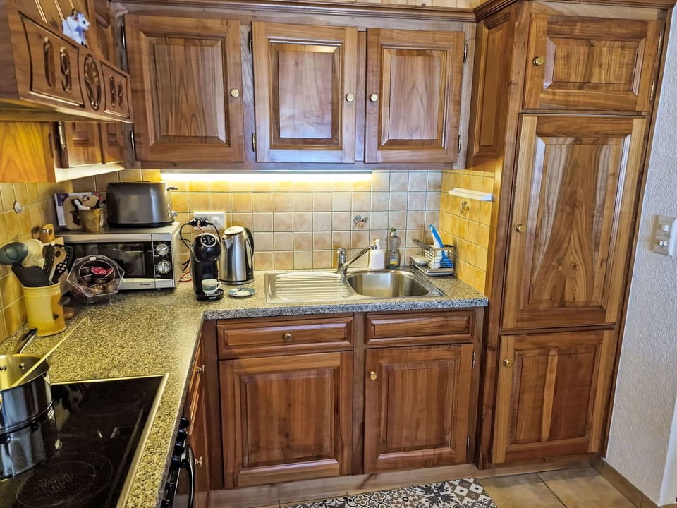 Kitchen, Cabinetry, Kitchen Appliance, Countertop, Major Appliance, Wood, Furniture, Cupboard, Interior Design, Flooring