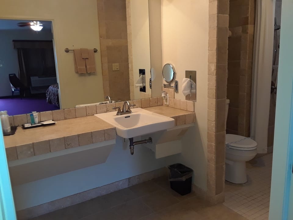 Suite, Multiple Beds, Accessible | Bathroom | Hair dryer, towels