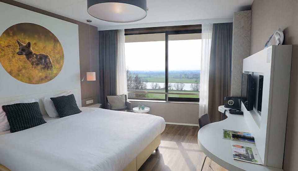 Wake up to serene countryside views from plush bedding.