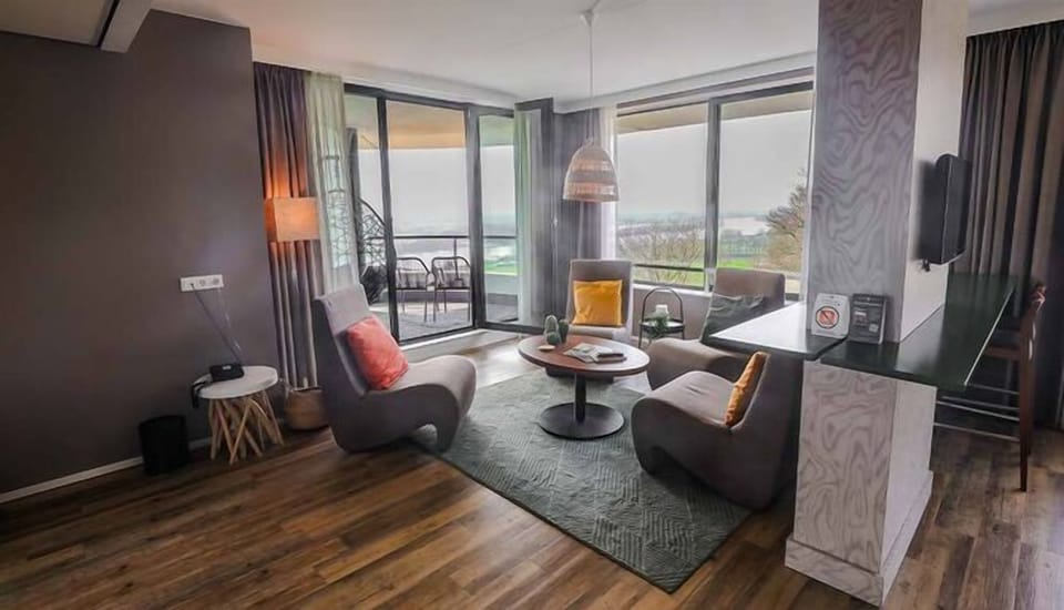 Lounge by floor-to-ceiling windows and step onto the balcony.