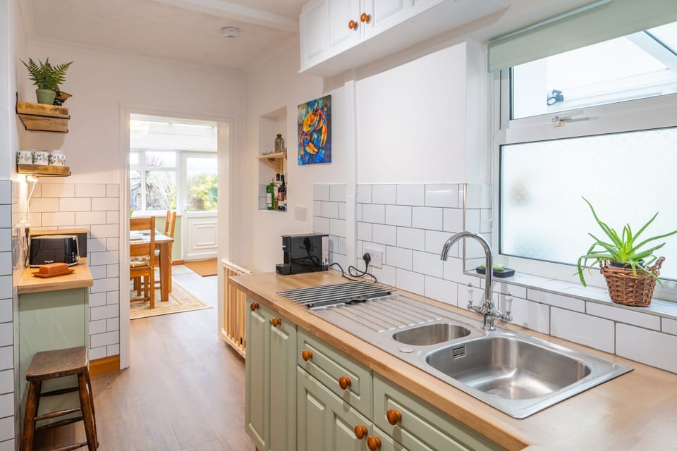 Ground floor: Kitchen with electric oven and gas hob, Nespresso coffee machine, microwave, dishwasher and fridge-freezer