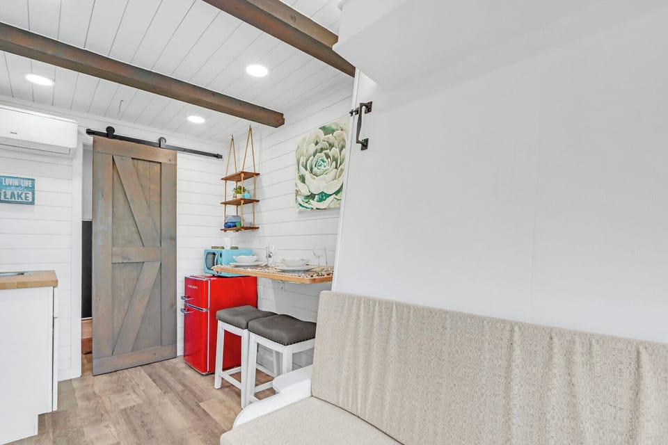 The dining nook and kitchenette are behind the seating