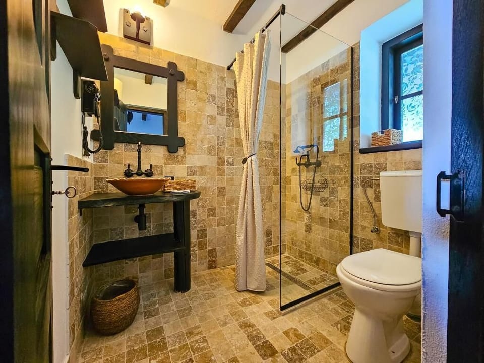 Shower, hair dryer, slippers, towels