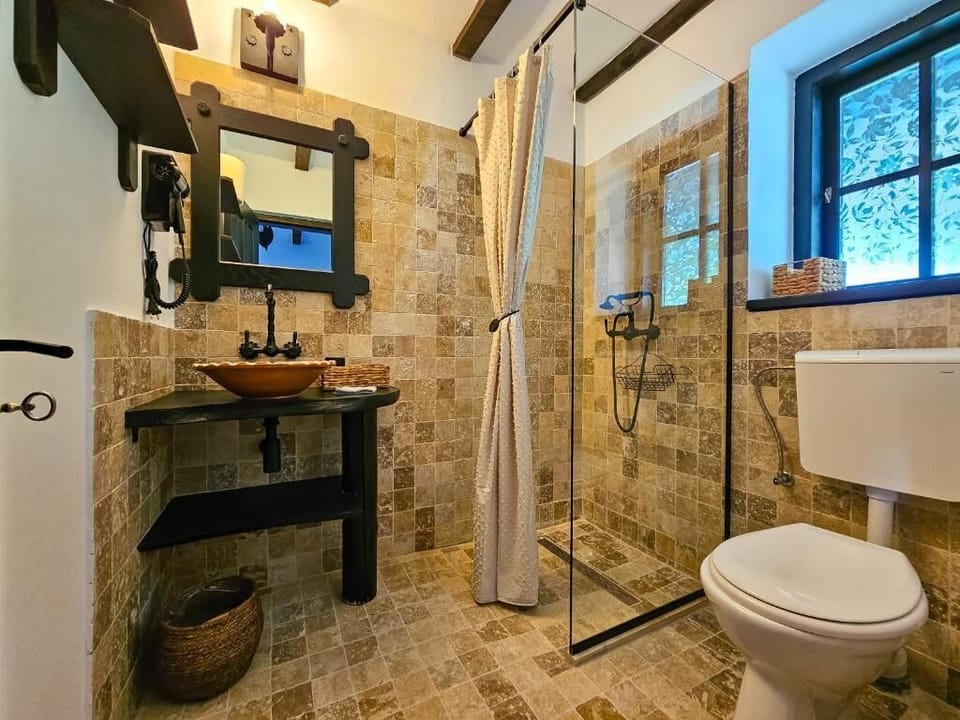 Double Room, Garden View | Bathroom | Shower, hair dryer, slippers, towels
