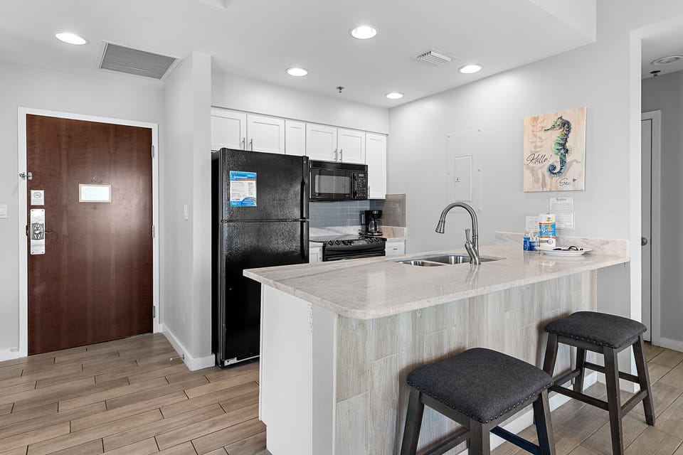 Updated kitchen with breakfast bar and everything needed for vacation meals