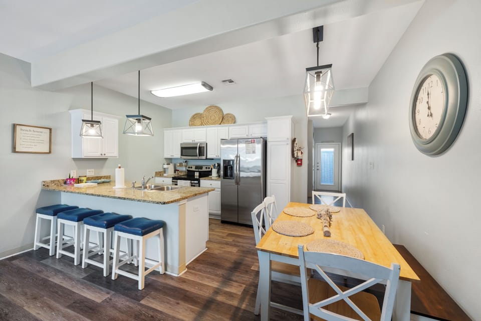 Your spacious kitchen welcomes you with granite counters, modern appliances, and a cozy breakfast nook perfect for morning coffee and meal prep.