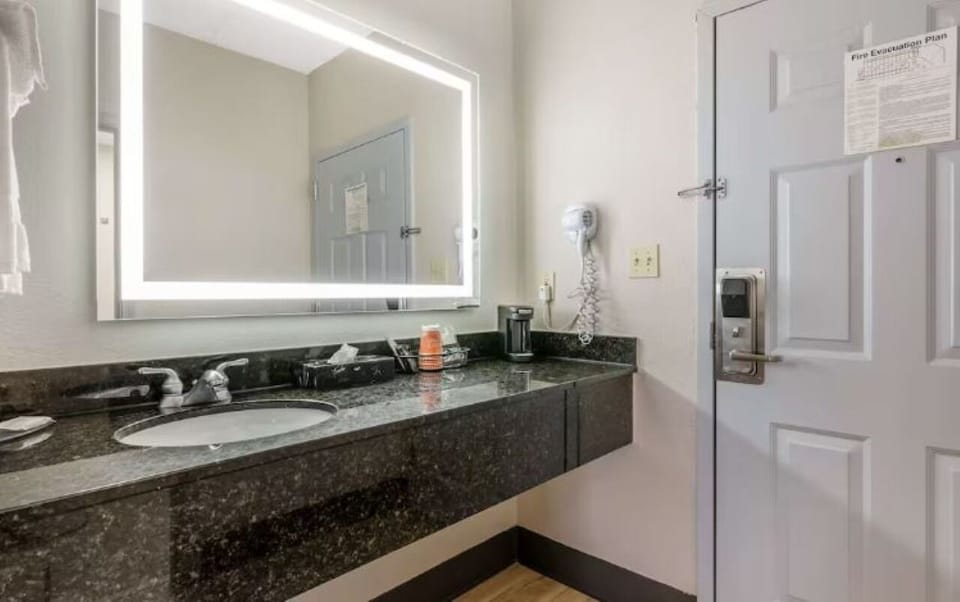 Get ready effortlessly at a bright vanity with ample counter.