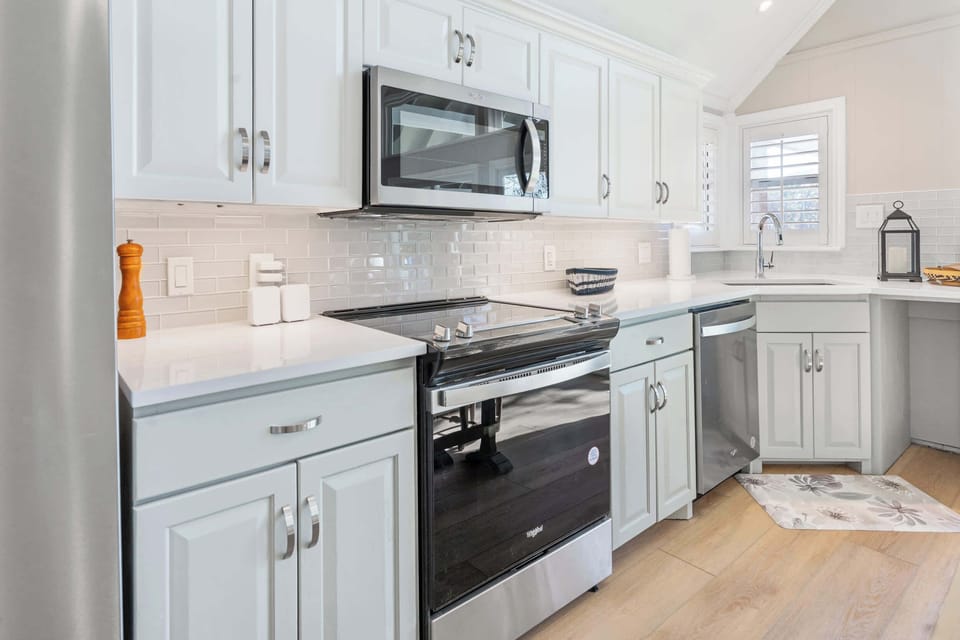 Beautiful cabinetry, quartz counters, and stainless steel appliances. Ample counterspace for preparing meals.