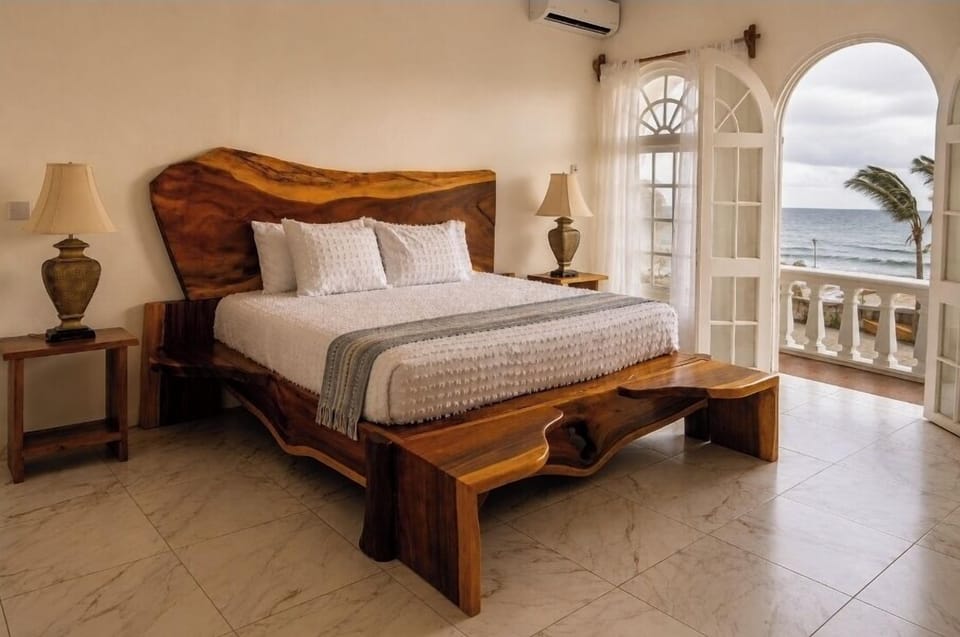 Luxury Room, 1 King Bed, Ocean View | In-room safe, desk, laptop workspace, blackout drapes