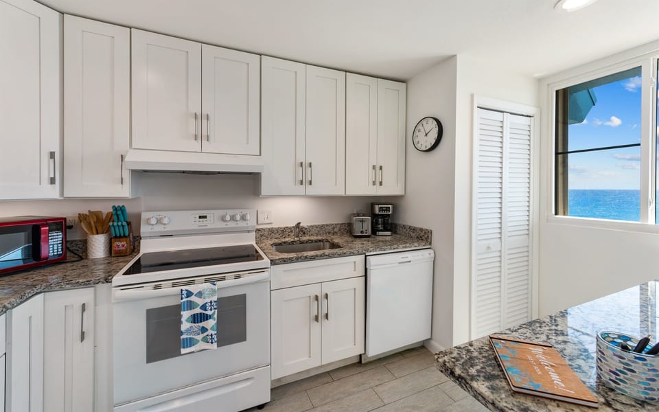 Well appointed kitchen with stove, oven, microwave and dishwasher