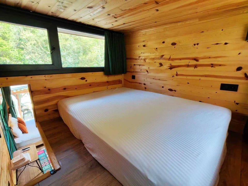 Classic Bungalow, River View | Living area | Flat-screen TV