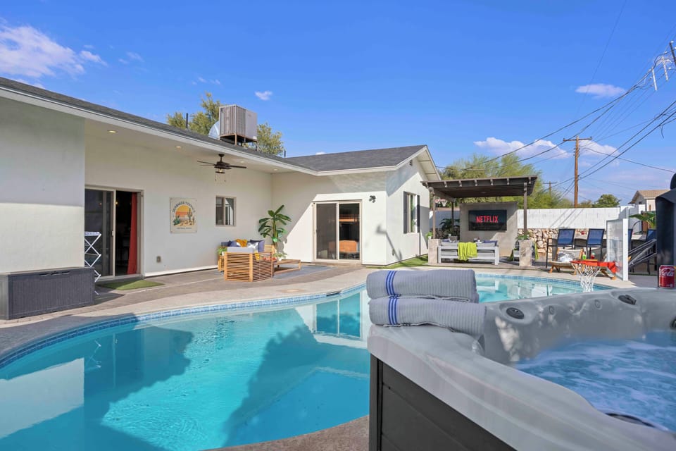 Private backyard oasis with pool, hot tub, and outdoor lounge area