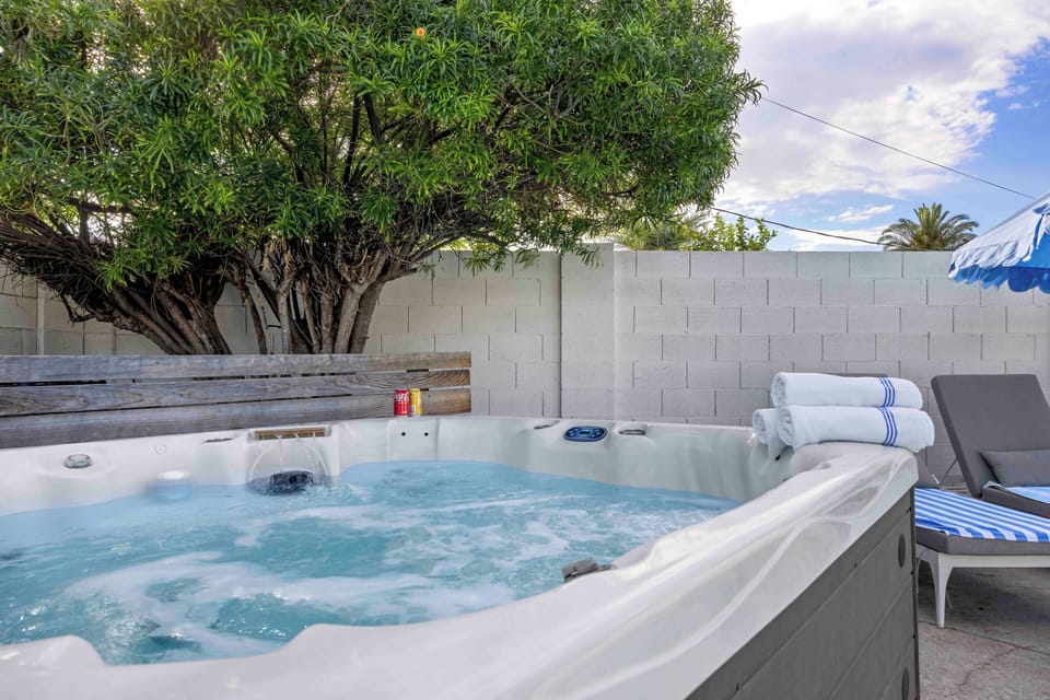 Relax poolside with a spa, shaded seating, and entertainment space