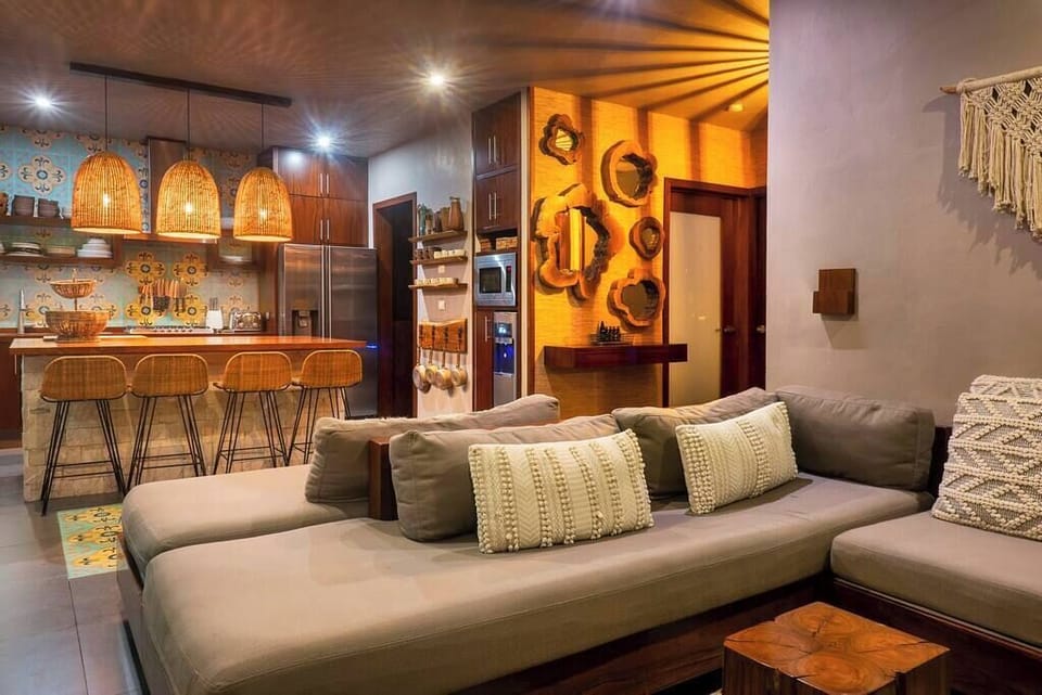 Incredible and stylish kitchen with an island in the middle, integrated with the living room