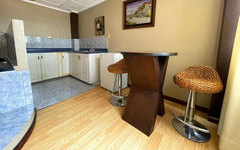 Deluxe Suite, Multiple Beds, Balcony, City View | Private kitchen | Mini-fridge, cookware/dishes/utensils