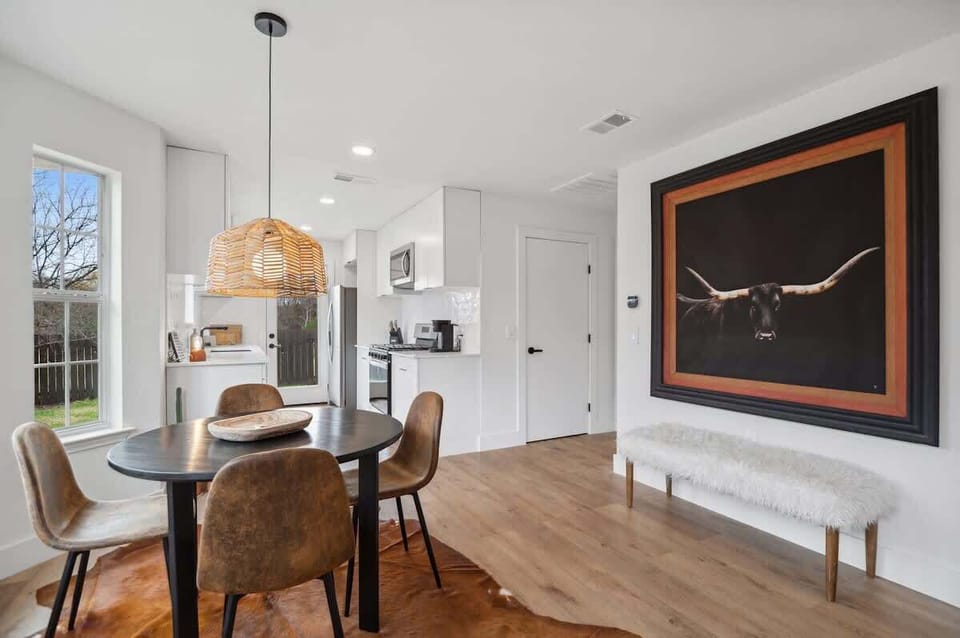 Open-concept dining area connected to a fully equipped kitchen for easy meals and gatherings.