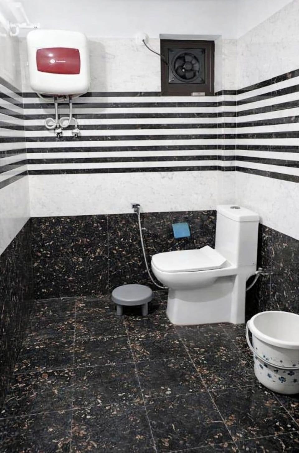 Shower, rainfall showerhead, slippers, towels
