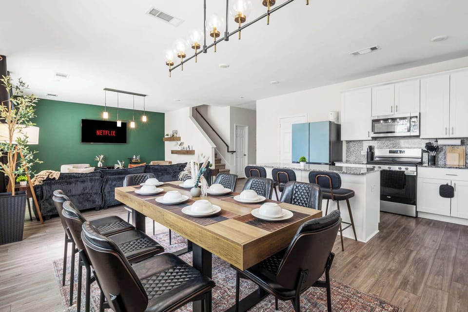 [Dining Area] Gather around the table for meals, games, planning, and memorable conversations.