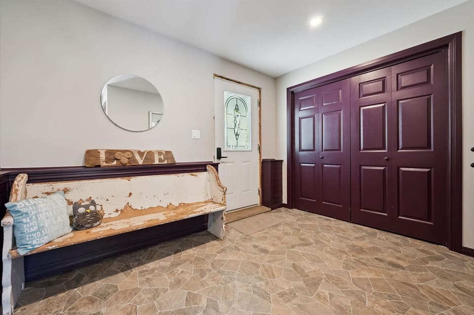 Spacious entry area with coat hooks and storage — perfect for boots and gear after outdoor adventures.