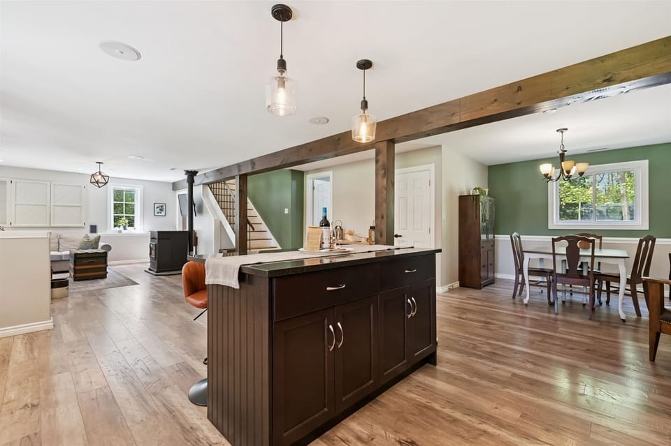 Spacious open layout connecting the kitchen, dining, and living areas — perfect for gathering.