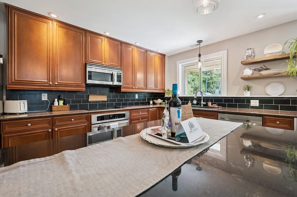 Fully equipped kitchen with large island and seating, ideal for cooking and socializing.