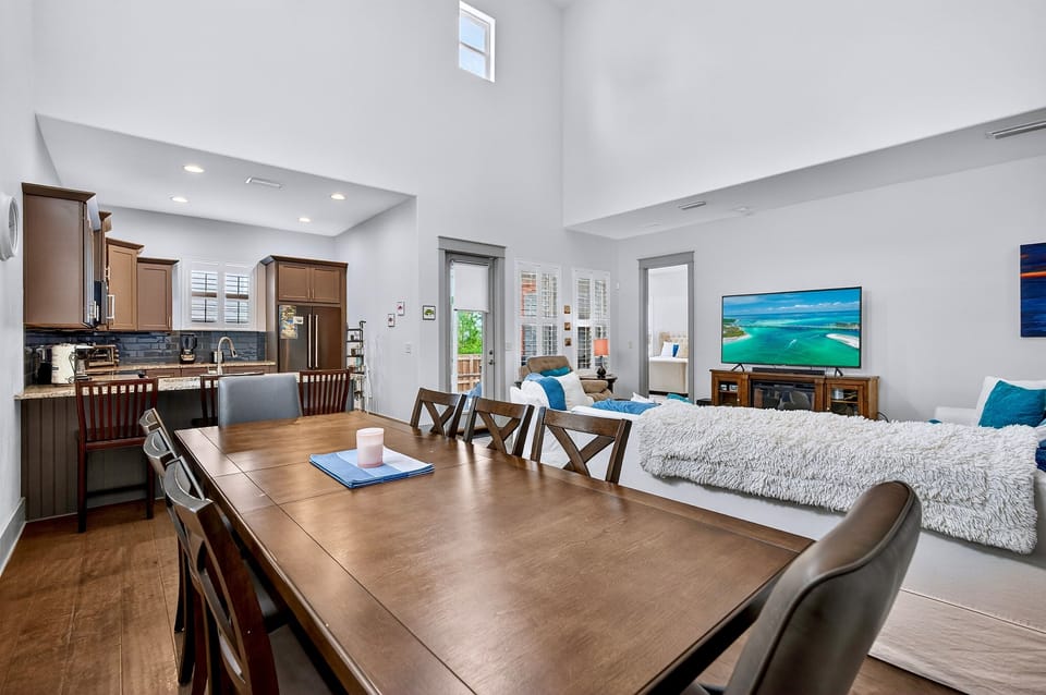 1st Floor - Spacious dining area with seating for 8 plus additional seating at the kitchen island, perfect for family meals and group gatherings. Open layout connects to the living room and chef’s kitchen.