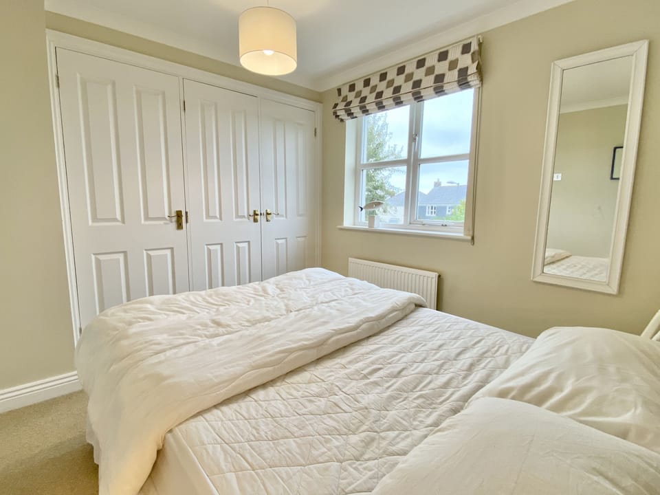 Wardrobes and double bed in Brea Holiday Cottage, Rock North Cornwall