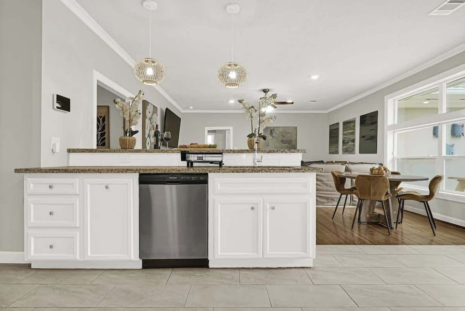 Bright open kitchen and living area with a large island, perfect for gathering, cooking, and enjoying time together.
