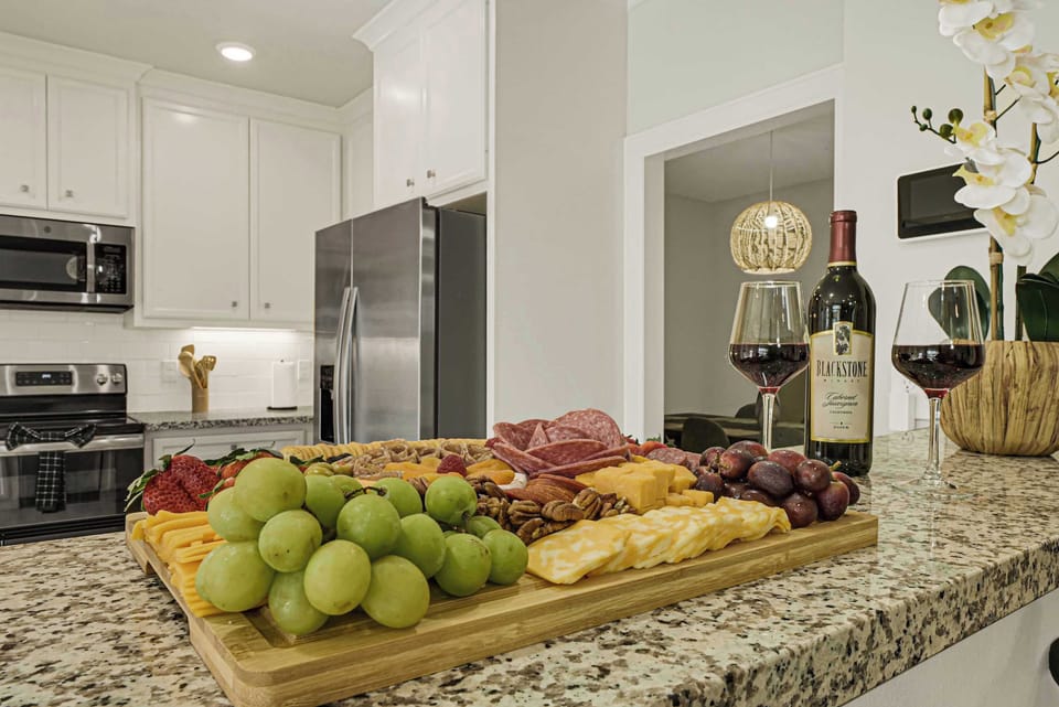 Bright kitchen with island (Snacks and wine not included)
