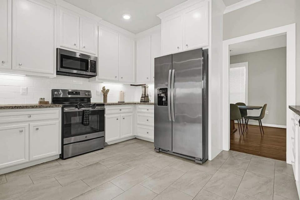Fully equipped modern kitchen with stainless steel appliances and plenty of counter space for easy meal preparation.