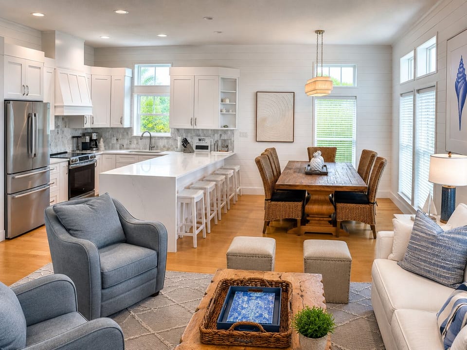 Bright open-concept kitchen, dining & living area with island seating