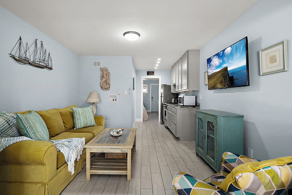 Spacious living room that flows into the kitchen, making it easy to cook, chat, and stream your favorite shows all in one place.